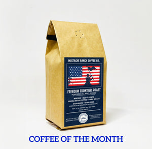 Mustache Ranch Coffee Co. Freedom Frontier Roast 12oz dark roast coffee bag with American flag label, featured as Coffee of the Month.